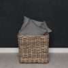 Large wicker storage basket with cushions