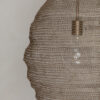 Close up of mesh wire in beehive light