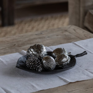 styled lifestyle shot with decorative silver ornaments